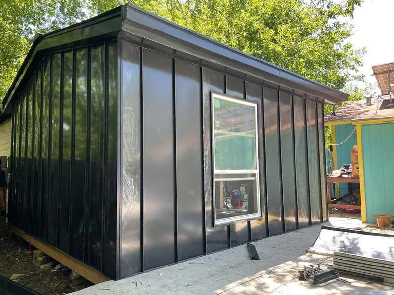 Black standing seam metal wall panels for Roof Inspection in Belle Isle