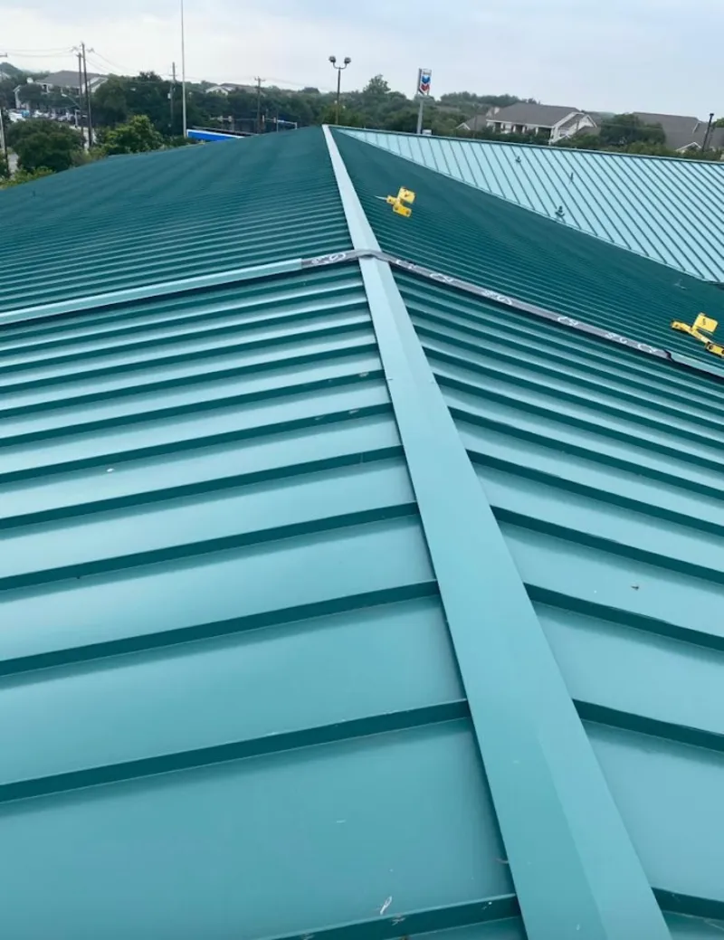Green commercial metal roof ridge and valley for Metal Roof Repair in Belle Isle