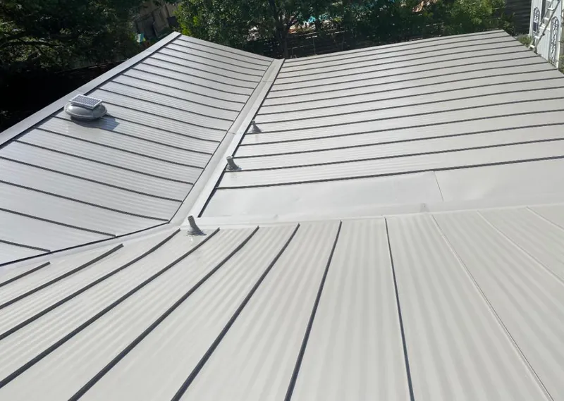 Solar attic fan installed on a metal roof for Roof Ventilation in Belle Isle